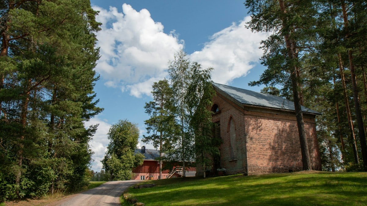 house beside dirt road during daytime